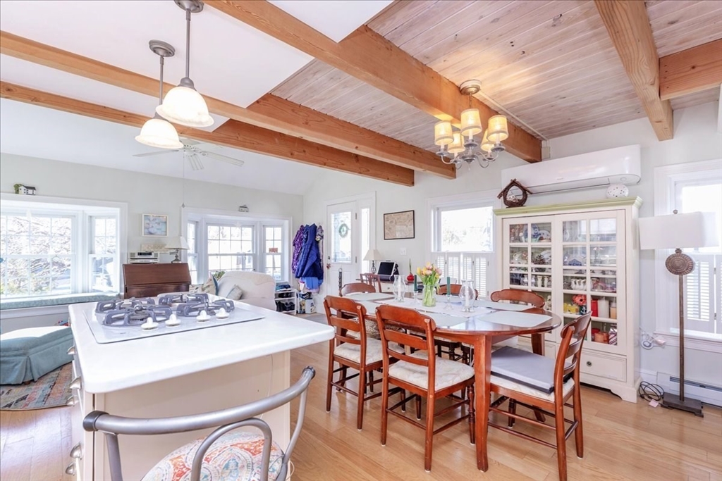 145 Evans Rd Extension Marblehead, MA 01945 - Photo 14 of 42 a view of a dining room with furniture window and wooden floor