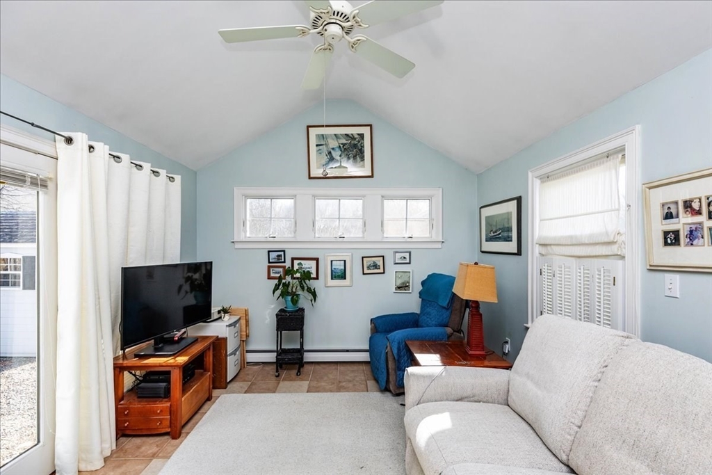 145 Evans Rd Extension Marblehead, MA 01945 - Photo 15 of 42 a living room with furniture and a flat screen tv