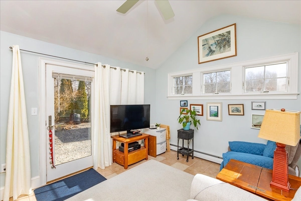 145 Evans Rd Extension Marblehead, MA 01945 - Photo 16 of 42 a living room with furniture and a flat screen tv