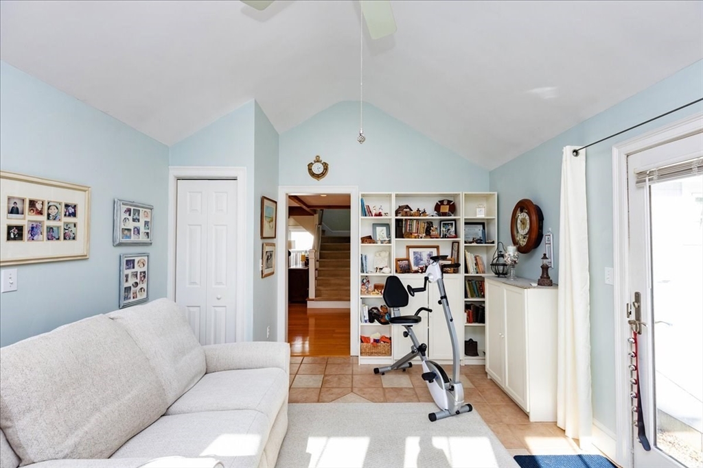 145 Evans Rd Extension Marblehead, MA 01945 - Photo 17 of 42 a living room with furniture a window and gym equipment