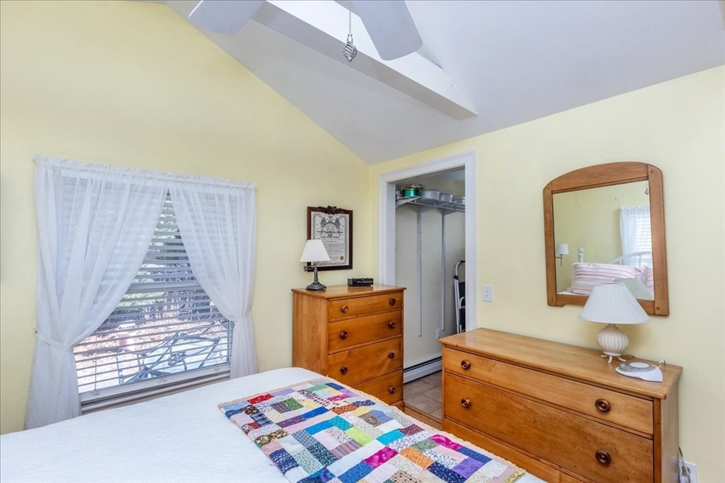 145 Evans Rd Extension Marblehead, MA 01945 - Photo 20 of 42 a bedroom with a bed and wooden floor