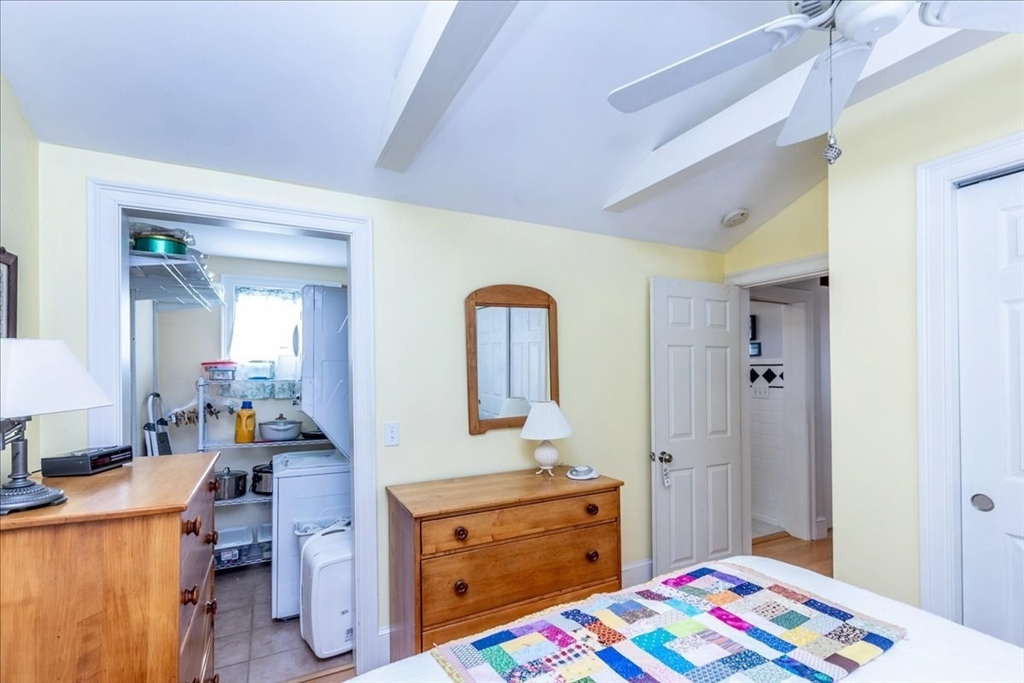 145 Evans Rd Extension Marblehead, MA 01945 - Photo 21 of 42 a bedroom with a bed and a dresser in it