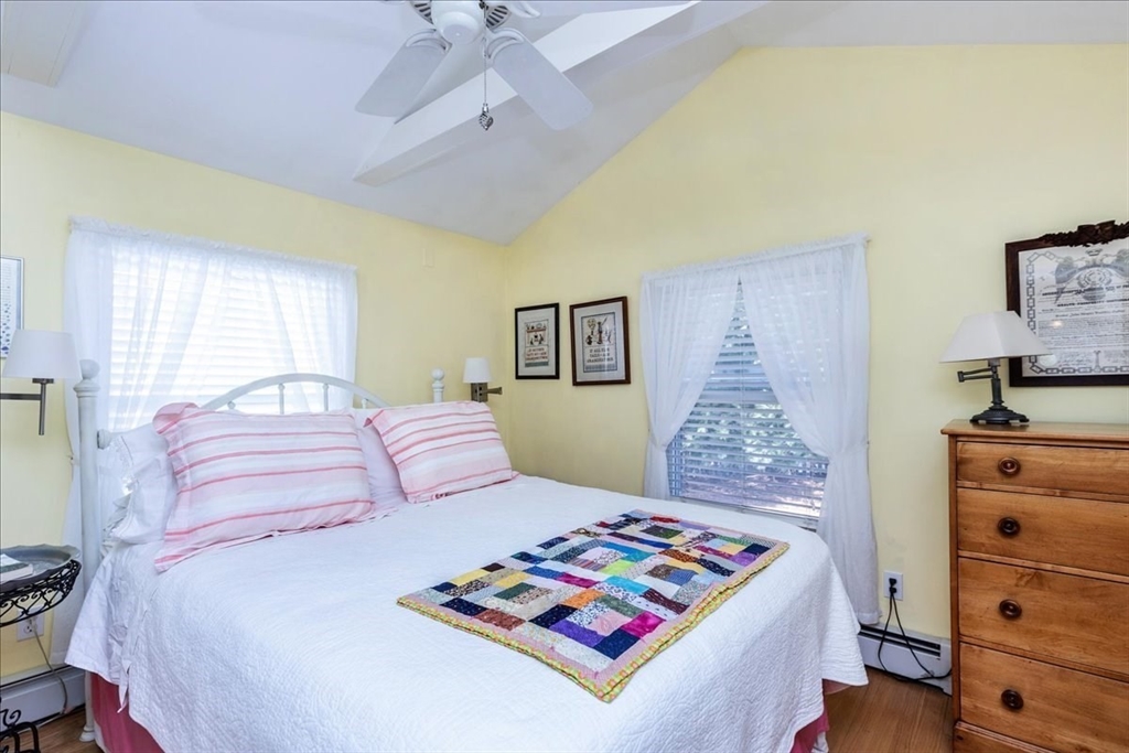 145 Evans Rd Extension Marblehead, MA 01945 - Photo 22 of 42 a bedroom with a bed and a dresser