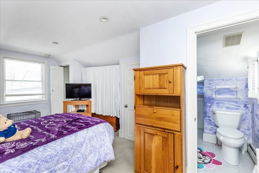 145 Evans Rd Extension Marblehead, MA 01945 - Photo 28 of 42 a bedroom with a bed and a television