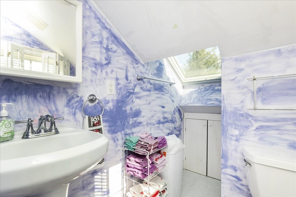 145 Evans Rd Extension Marblehead, MA 01945 - Photo 29 of 42 a bathroom with a sink a toilet and mirror