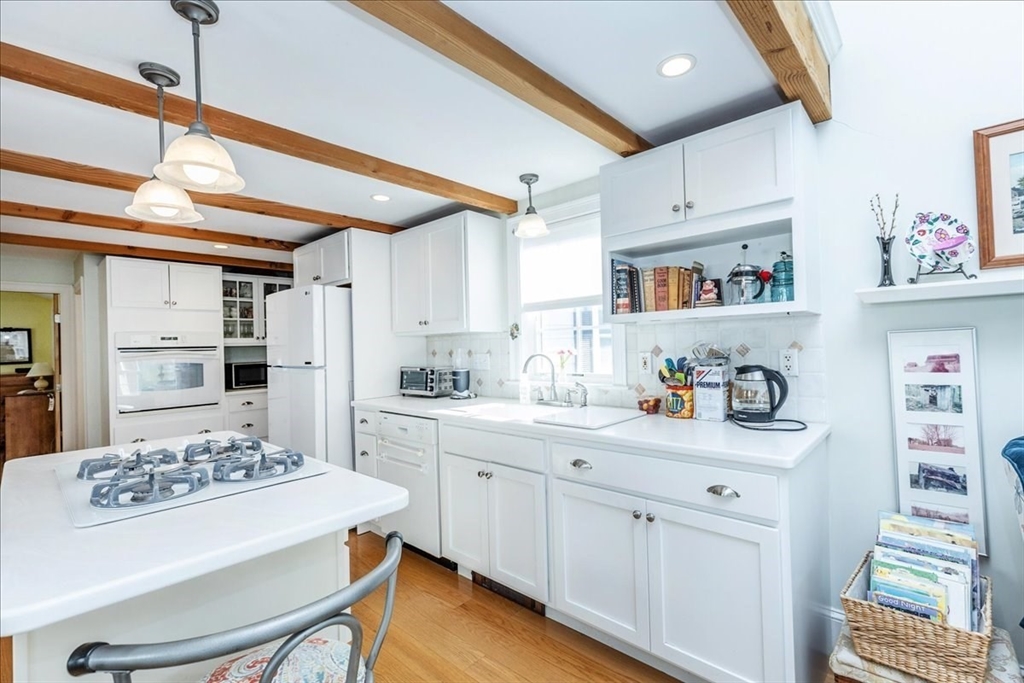 145 Evans Rd Extension Marblehead, MA 01945 - Photo 3 of 42 a kitchen with cabinets and window