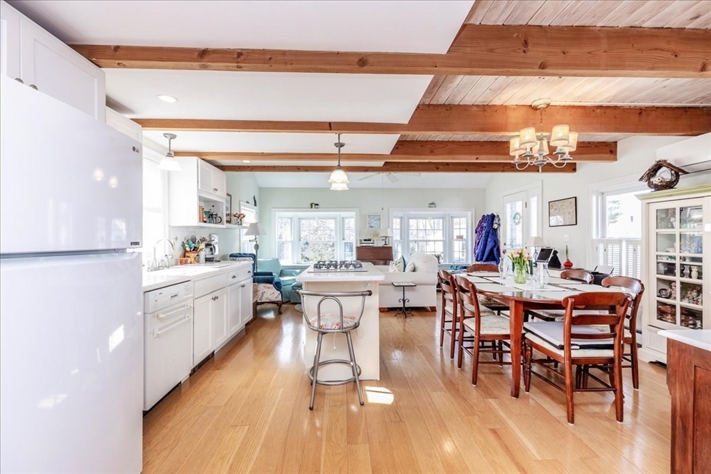 145 Evans Rd Extension Marblehead, MA 01945 - Photo 6 of 42 a room with stainless steel appliances kitchen island granite countertop furniture and a dining table