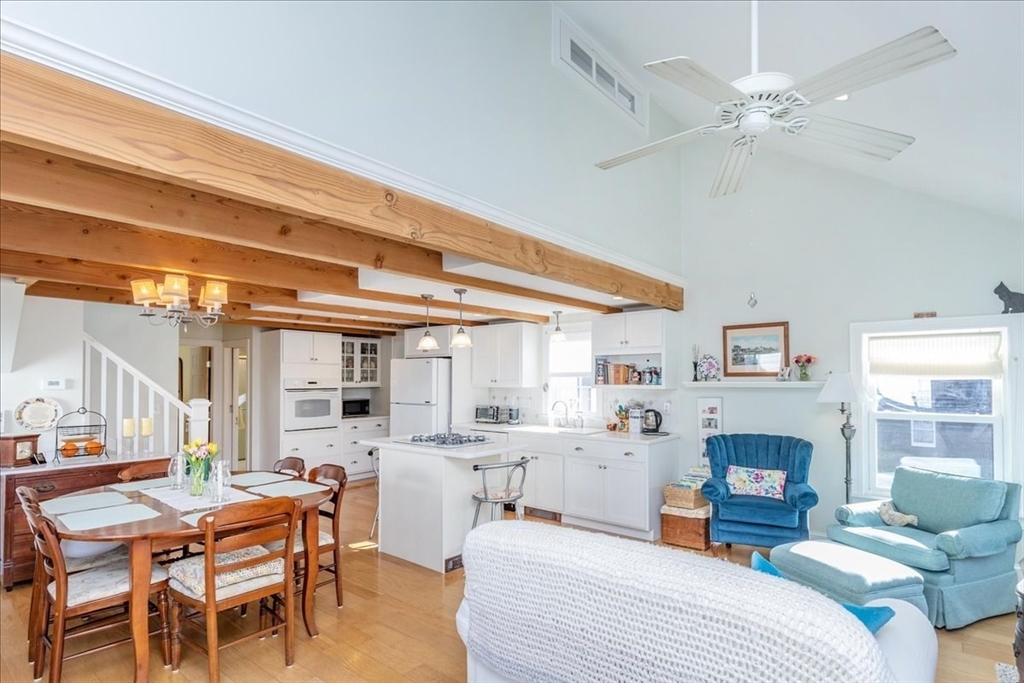 145 Evans Rd Extension Marblehead, MA 01945 - Photo 7 of 42 a bedroom with a bed and a table with the kitchen view