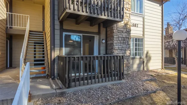 a view of a brick house with many windows