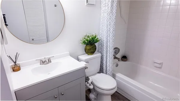 a bathroom with a sink a toilet and a bathtub