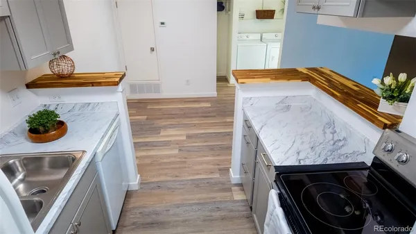 a bathroom with a sink a washer and dryer