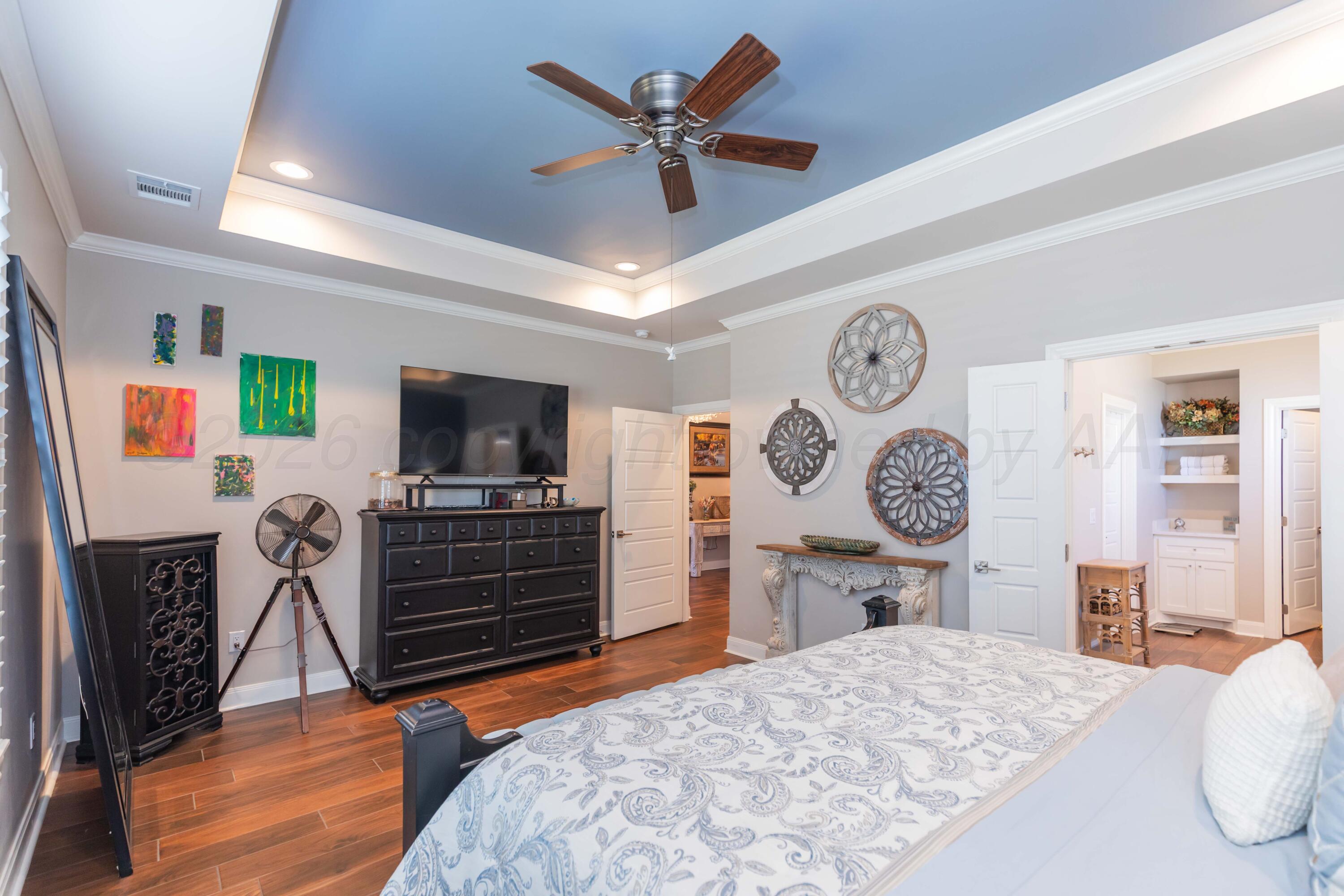 2809 Pensacola Avenue Amarillo, TX 79118 - Photo 15 of 36 a bedroom with furniture and wooden floor