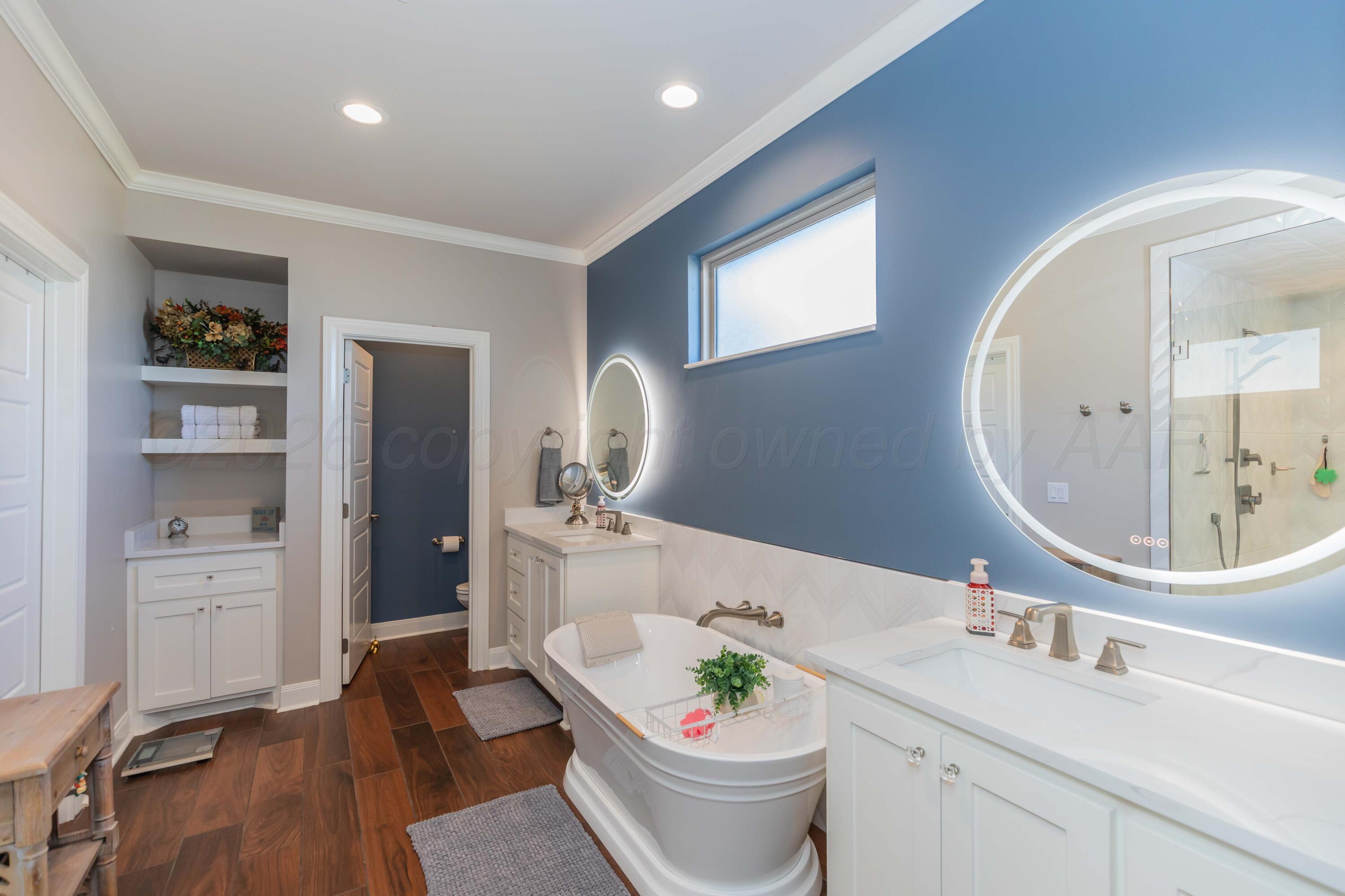 2809 Pensacola Avenue Amarillo, TX 79118 - Photo 20 of 36 a bathroom with a granite countertop sink toilet and shower