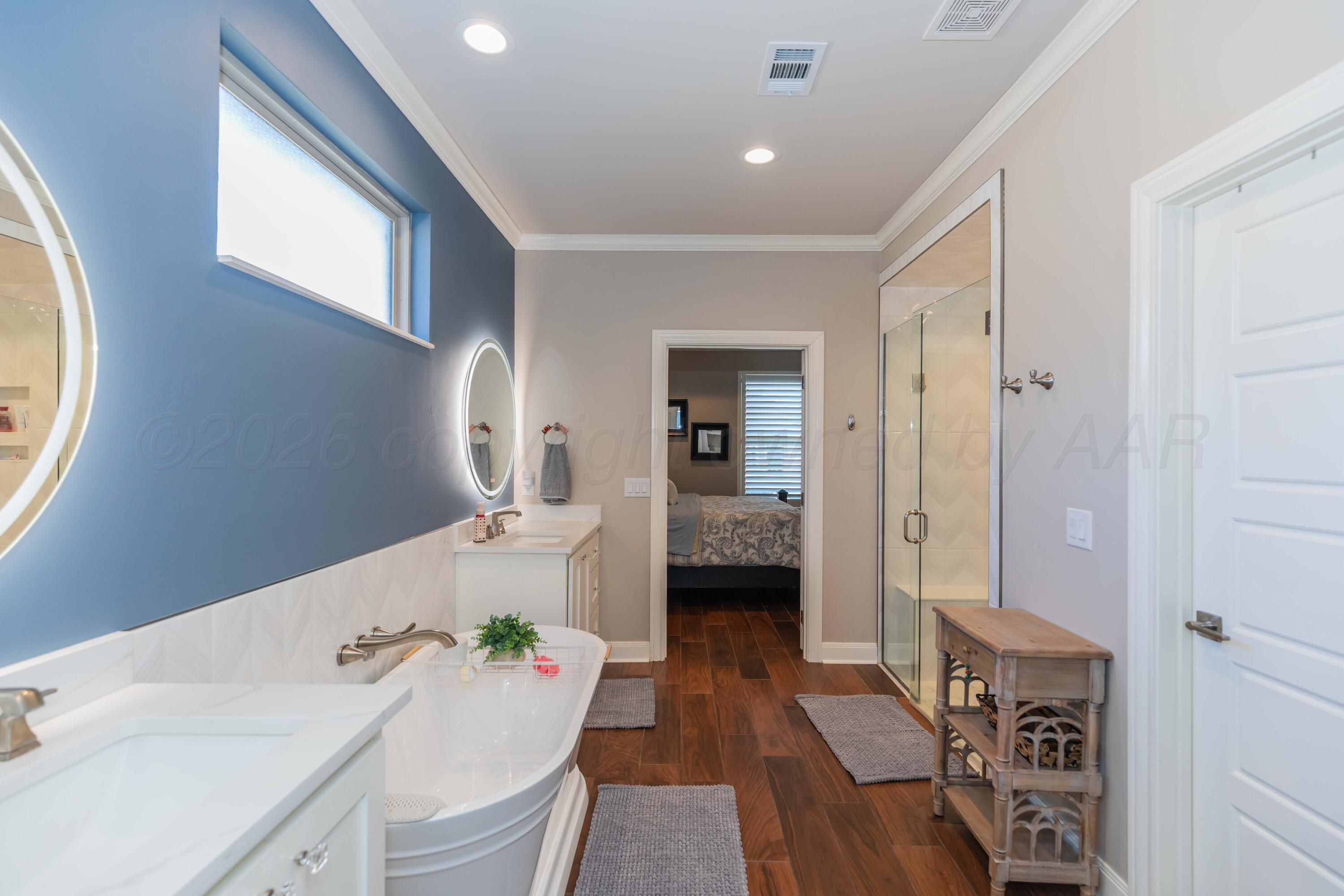 2809 Pensacola Avenue Amarillo, TX 79118 - Photo 21 of 36 a en suite spacious bathroom with a double vanity sink a mirror and a shower