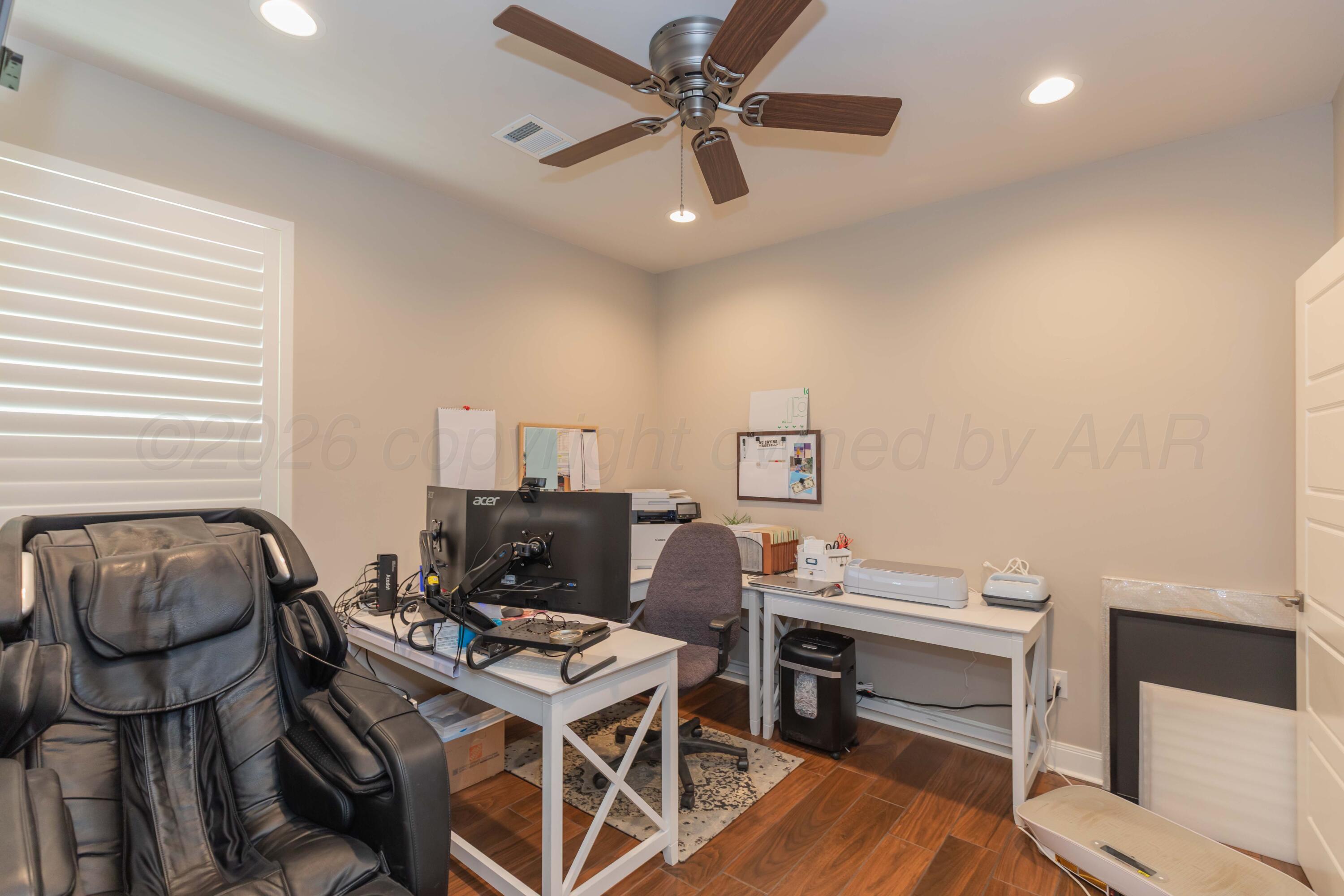 2809 Pensacola Avenue Amarillo, TX 79118 - Photo 24 of 36 a workspace with furniture and wooden floor