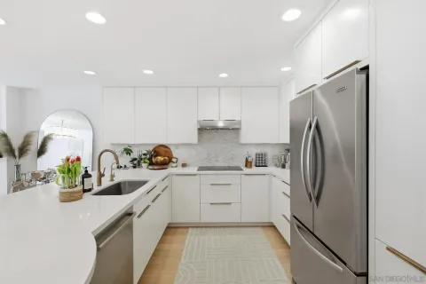 a bedroom with a bed and a painting on the wall