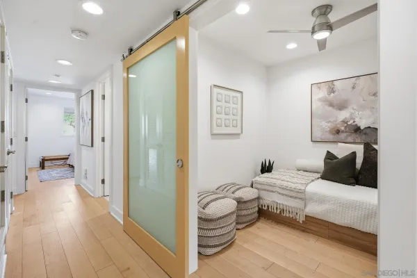 a bathroom with a sink a toilet a mirror and shower