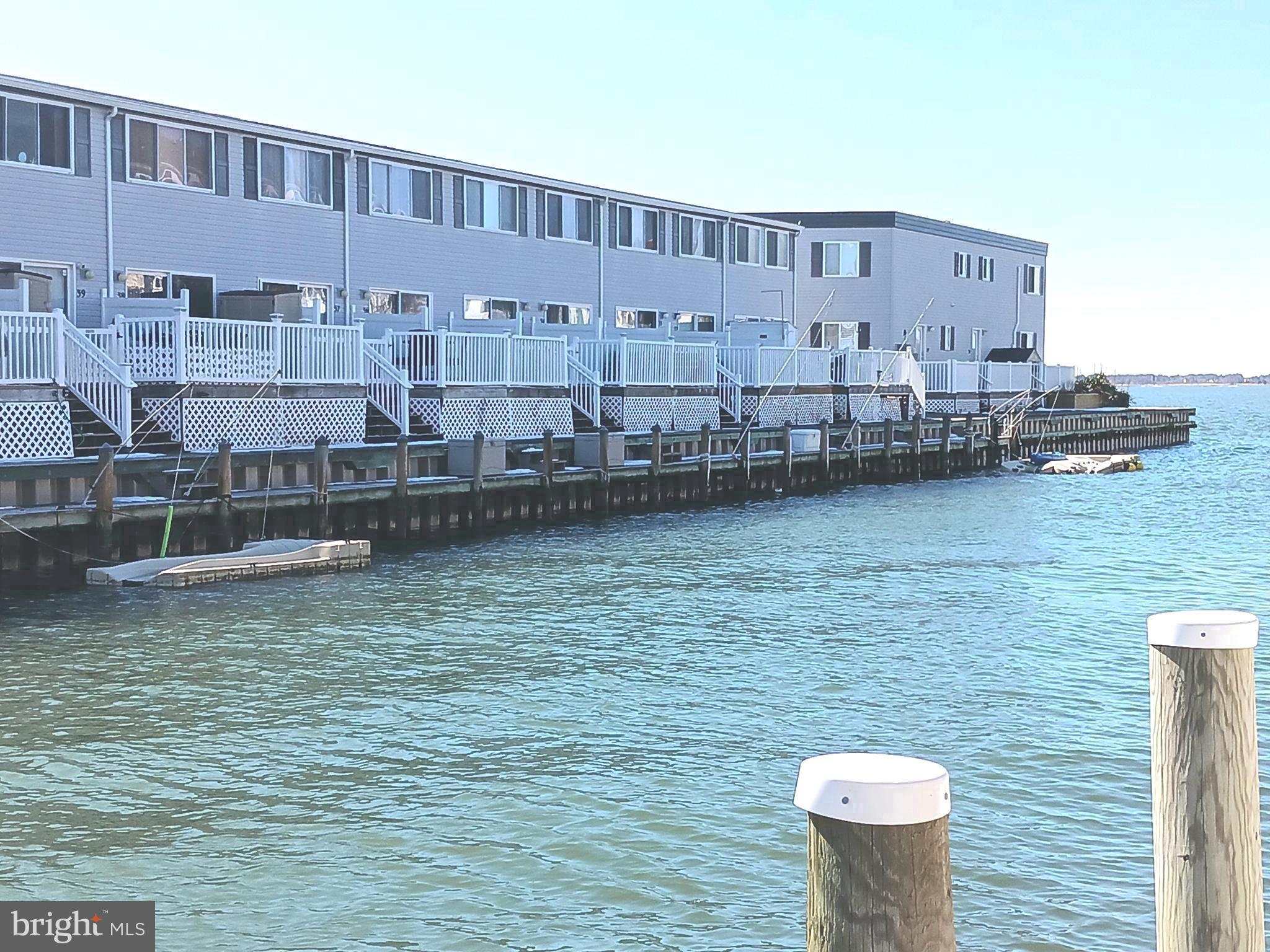 720 Rusty Anchor Road, Unit 39C Ocean City, MD 21842 - Photo 35 of 37 Wide Canal with Direct Bay Access