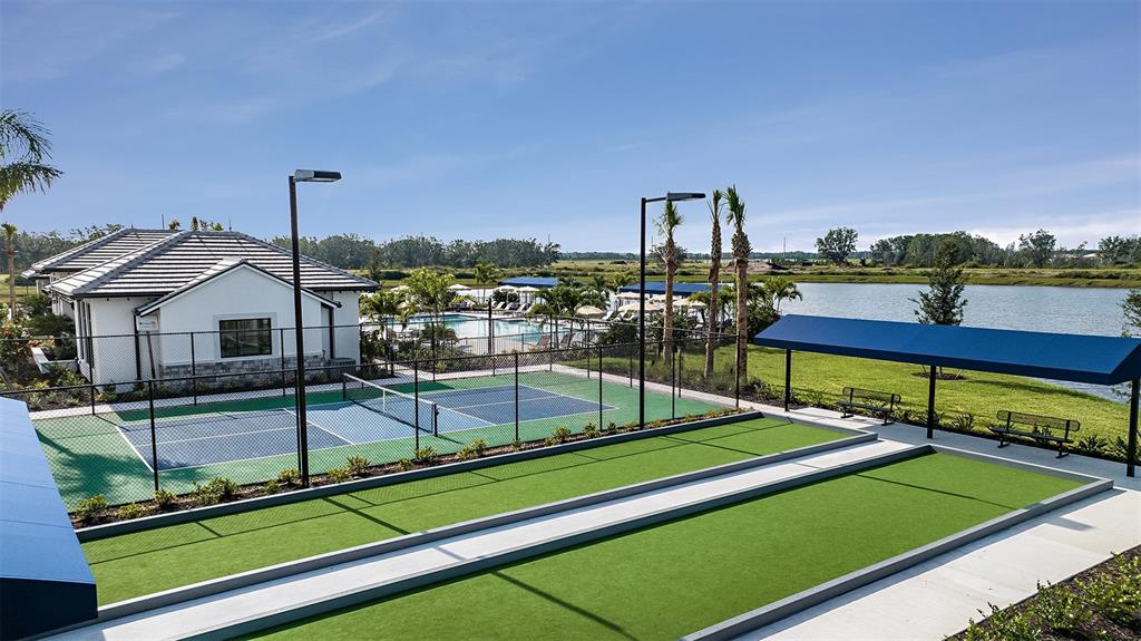 18131 Cherished Loop Lakewood Ranch, FL 34211 - Photo 20 of 21 a view of a tennis ground with large trees