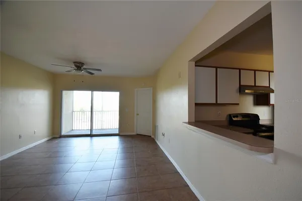 a view of a kitchen with a sink and a window