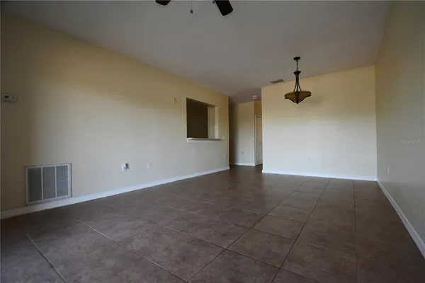 a view of an empty room with a fireplace