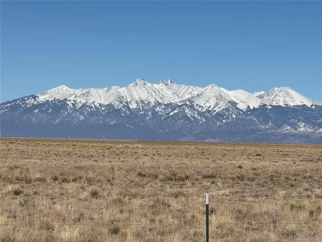 a view of a yard with a mountain