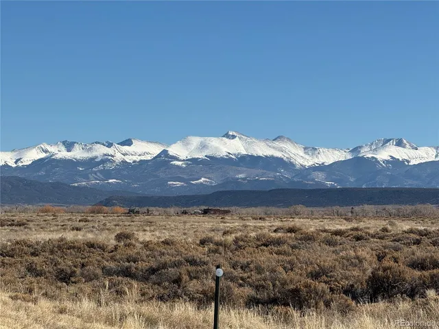 a view of a large building with a mountain in the background