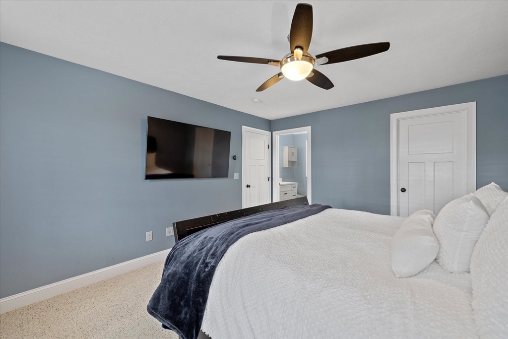 81 Central Tree Road Rutland, MA 01543 - Photo 17 of 31 a bedroom with a large bed and a flat tv screen on a dresser