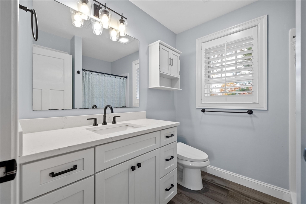 81 Central Tree Road Rutland, MA 01543 - Photo 18 of 31 a bathroom with a toilet a sink and mirror