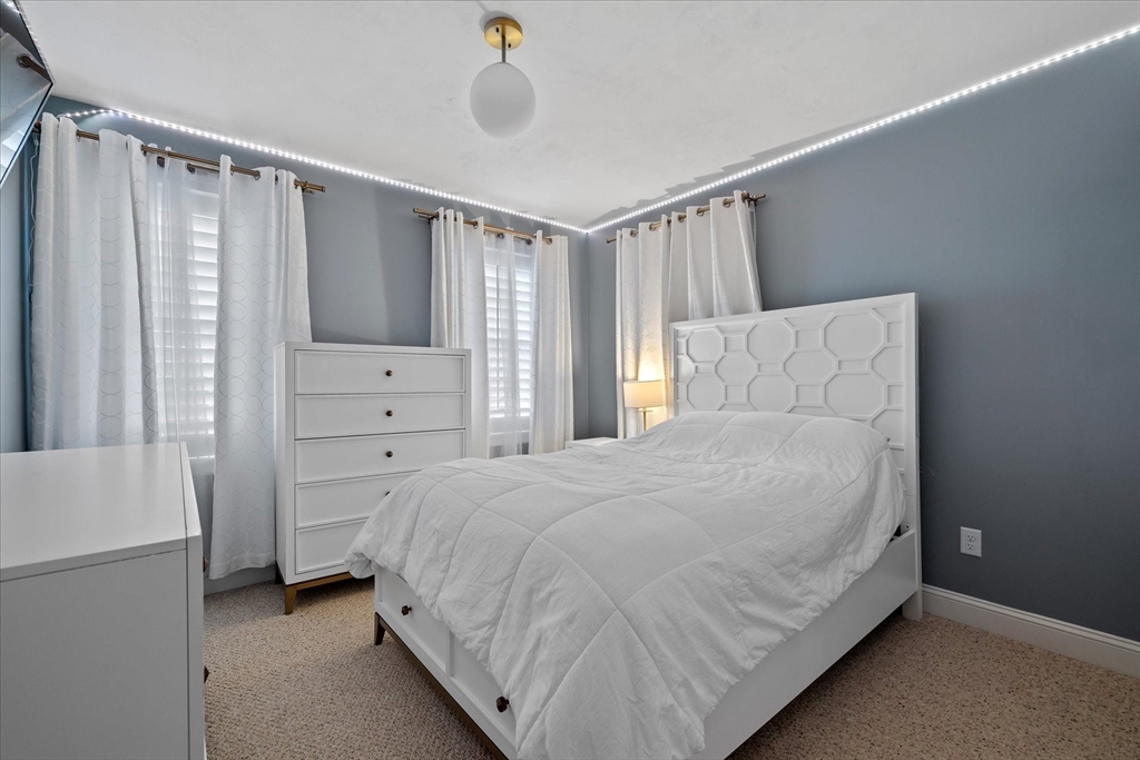 81 Central Tree Road Rutland, MA 01543 - Photo 19 of 31 a bedroom with a bed and a window