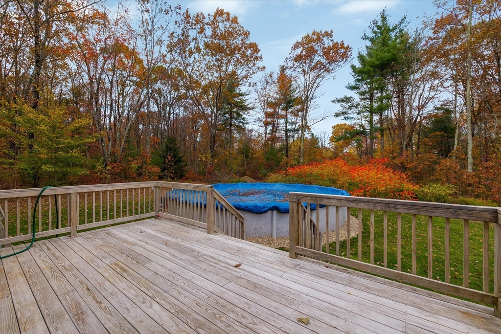 81 Central Tree Road Rutland, MA 01543 - Photo 26 of 31 a view of a wooden deck with a yard