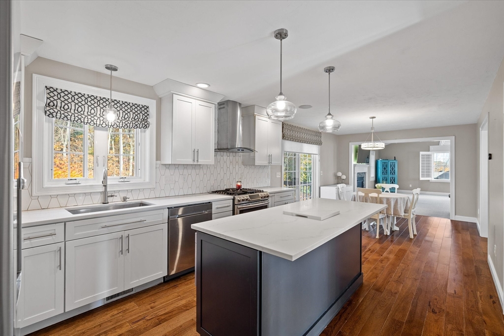 81 Central Tree Road Rutland, MA 01543 - Photo 6 of 31 a kitchen with a sink stove and wooden floor