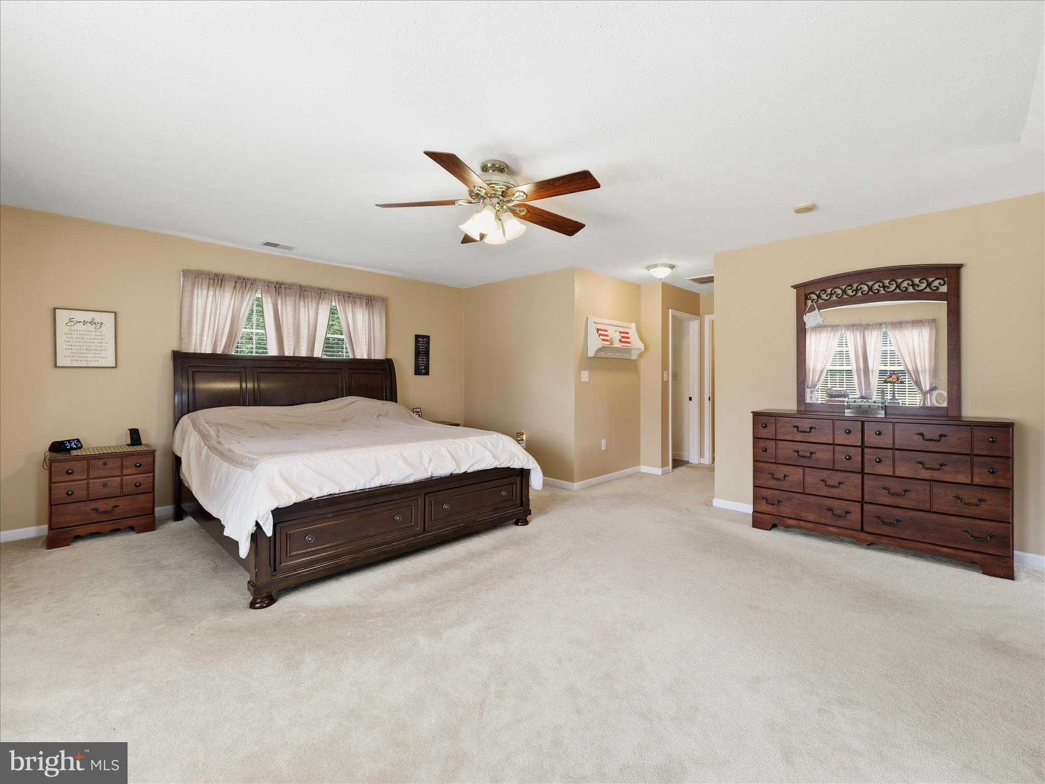 726 Doe Run Road Inwood, WV 25428 - Photo 45 of 68 a bedroom with a bed dresser and wooden floor