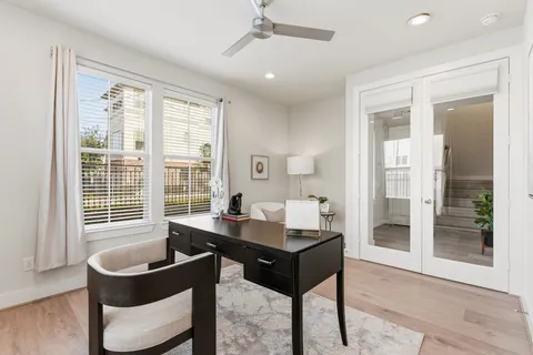 a dining room with furniture and window