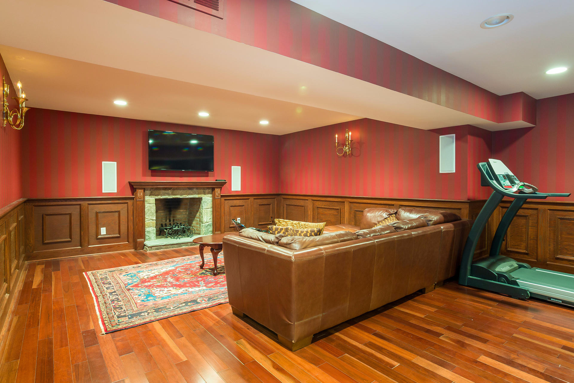 74 Doolittle Road Stamford, CT 06902 - Photo 25 of 28 a living room with furniture a flat screen tv and a fireplace