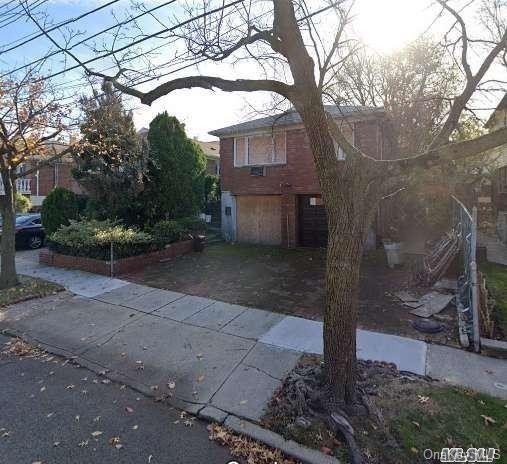 a view of a house with a tree
