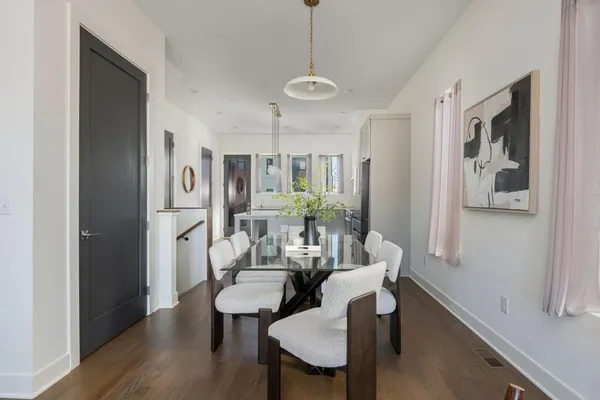 a view of a dining room with furniture window and wooden floor