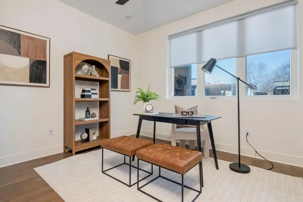 a workspace room with furniture