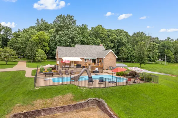 an outdoor space with furniture and garden