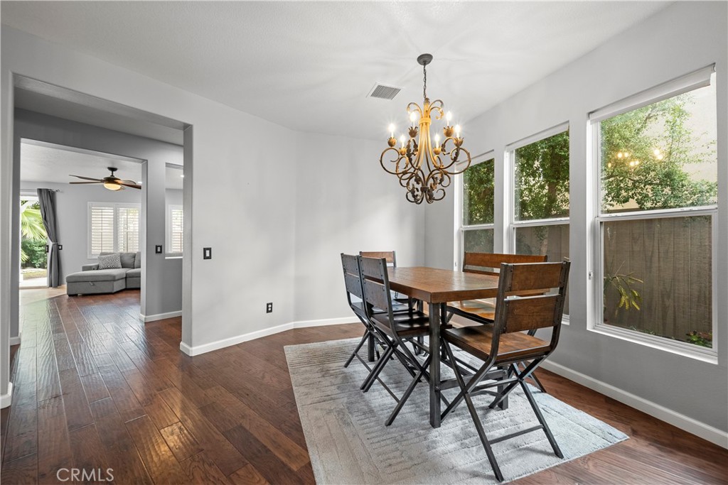 28640 Silverking Trail Saugus, CA 91390 - Photo 11 of 53 a view of a dining room with furniture wooden floor and chandelier