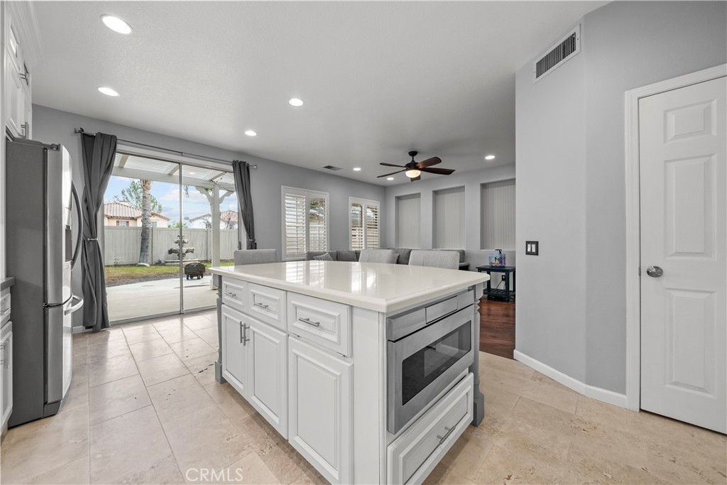 28640 Silverking Trail Saugus, CA 91390 - Photo 14 of 53 a kitchen with stainless steel appliances granite countertop a stove and a large refrigerator