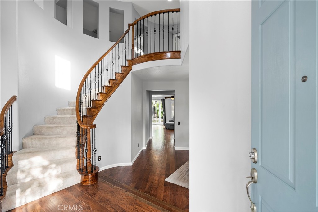 28640 Silverking Trail Saugus, CA 91390 - Photo 2 of 53 a view of staircase with wooden floor and a rug