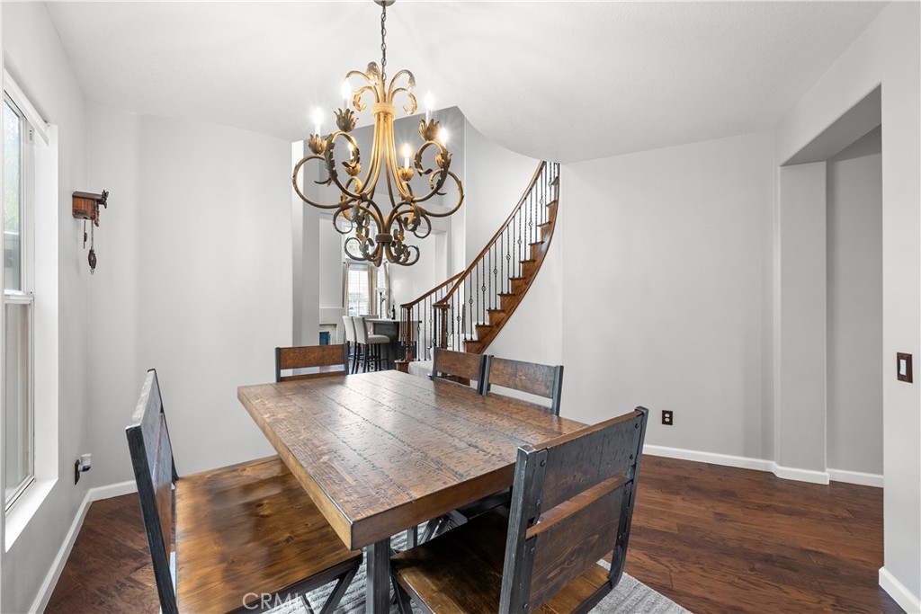 28640 Silverking Trail Saugus, CA 91390 - Photo 5 of 53 a view of a dining room with furniture wooden floor and a chandelier
