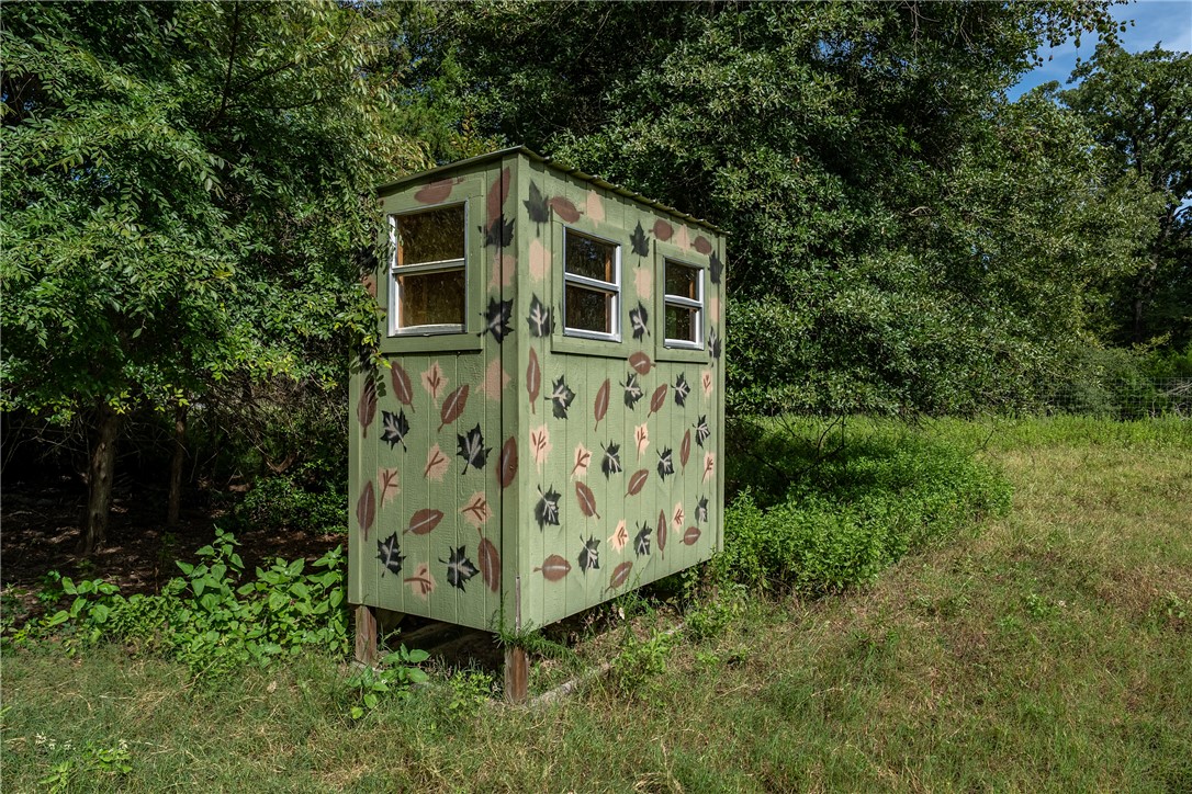 2033 Lcr 704, Unit COUNTYROAD Kosse, TX 76653 - Photo 19 of 31 a front view of a house with garden