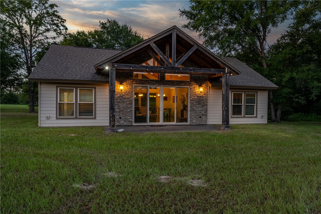 2033 Lcr 704, Unit COUNTYROAD Kosse, TX 76653 - Photo 5 of 31 a front view of a house with a garden
