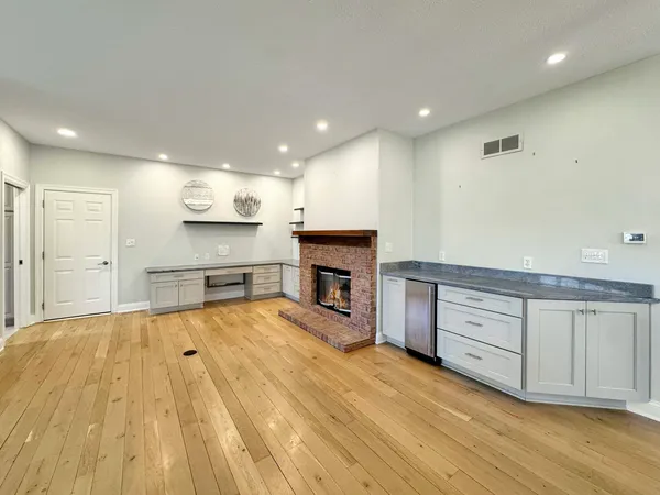 a view of bathroom with a sink and mirror