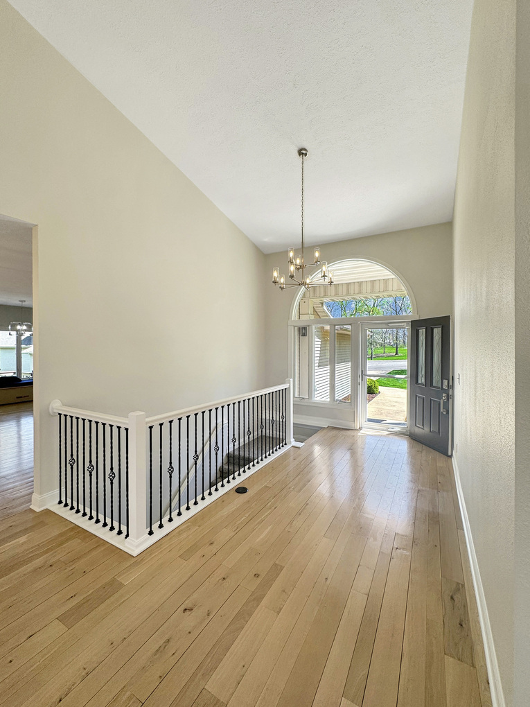 1669 Barberry Circle Freeport, IL 61032 - Photo 20 of 67 a view of a room with wooden floor chandelier and entryway