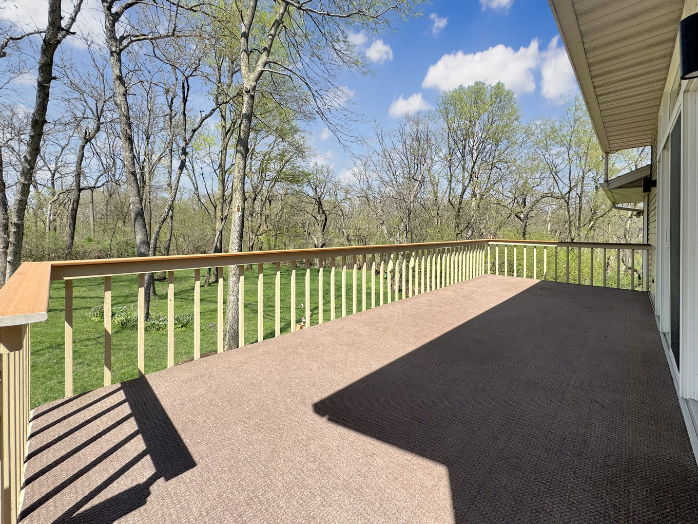 1669 Barberry Circle Freeport, IL 61032 - Photo 27 of 67 a view of balcony with wooden floor and fence