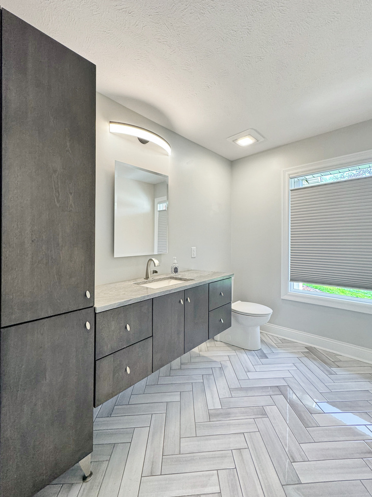 1669 Barberry Circle Freeport, IL 61032 - Photo 28 of 67 a spacious bathroom with a double vanity sink a mirror and a toilet