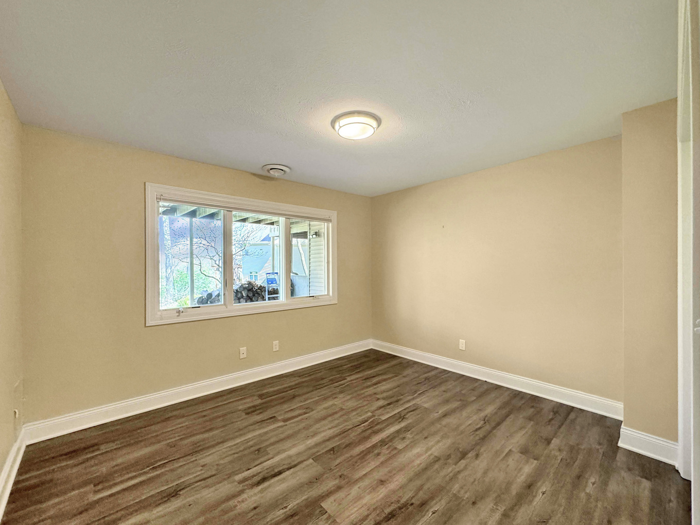 1669 Barberry Circle Freeport, IL 61032 - Photo 39 of 67 a view of an empty room with wooden floor and a window